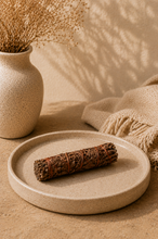 Load image into Gallery viewer, Deep red Dragon's Blood Egyptian sage smudge stick on a dark ritual surface — hand harvested from the sacred mountains of Saint Catherine, Sinai